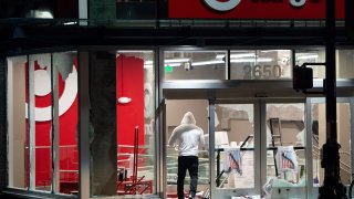 Looters rob a Target store as protesters face off against police in Oakland California