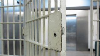 Stock photo of an open jail door
