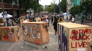 Barricades erected by the city several days ago divide up the CHOP zone on June 19, 2020 in Seattle, Washington. The concrete barriers, wrapped in plywood for painting, were installed to protect the free speech zone while still allowing one lane of traffic to get through. Nevertheless, protesters have blocked off entrances to traffic.