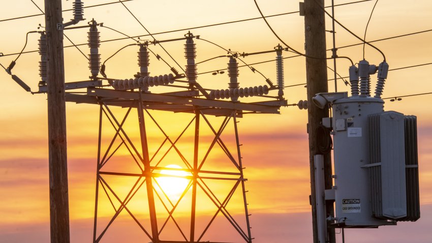 File Image: Power lines and transmission towers at sunrise in Crockett, California, U.S., on Wednesday, Aug. 19, 2020.