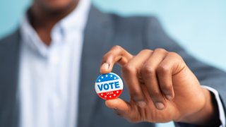 vote button in hand