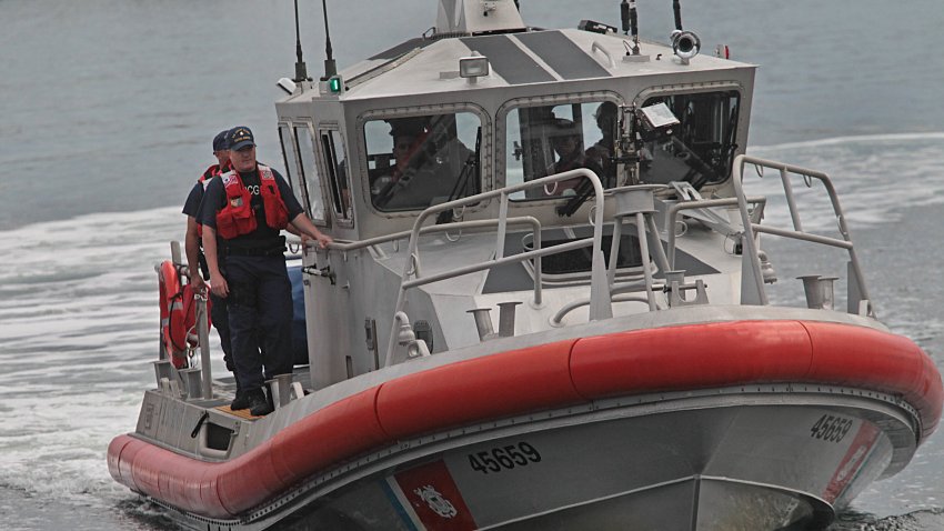 BOSTON – SEPTEMBER 27: A US Coast Guard boat brings Nathan Carman to a Coast Guard base in Boston on Sept. 27, 2016, after surviving the sinking of his 32-foot fishing boat near Block Canyon, off New York, in the Atlantic Ocean on Sept. 18. He was picked up in a lifeboat about 100 nautical miles south of Martha’s Vineyard on Sept. 25 by a Chinese freighter. His mother, who was on the "Chicken Pox" with him, has not been found. (Photo by Suzanne Kreiter/The Boston Globe via Getty Images)