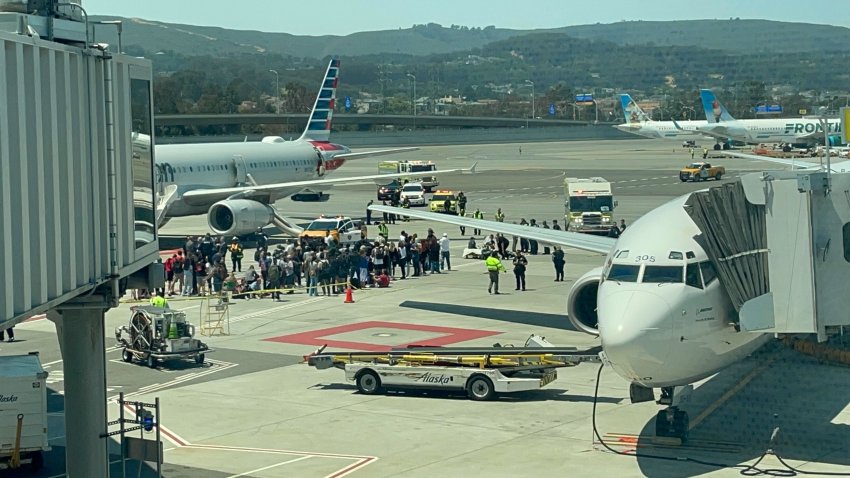 Crews respond to an incident involving an American Airlines plane at SFO. (July 12, 2024)