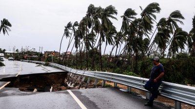 México: gran parte bajo el agua; John y Helene siguen causando daños