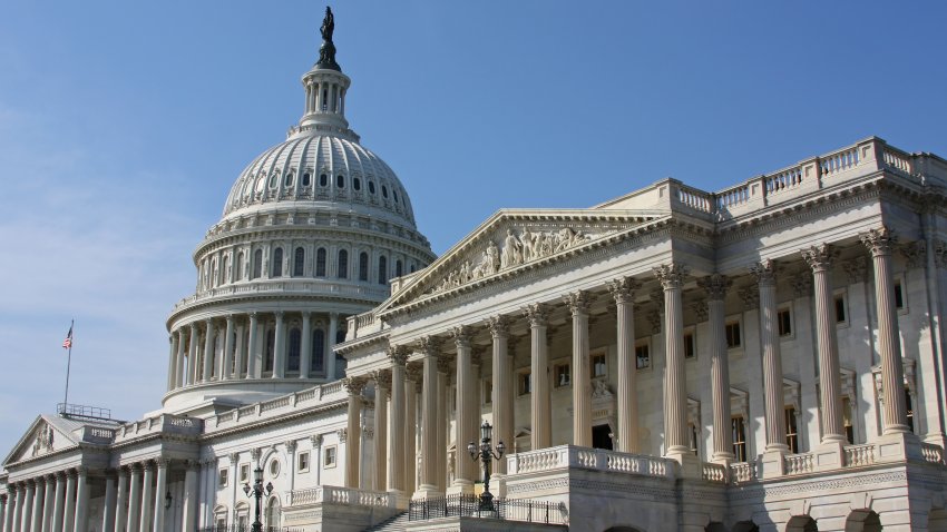 The Capitol in Washington DC on a sunny day. Side view of the front.