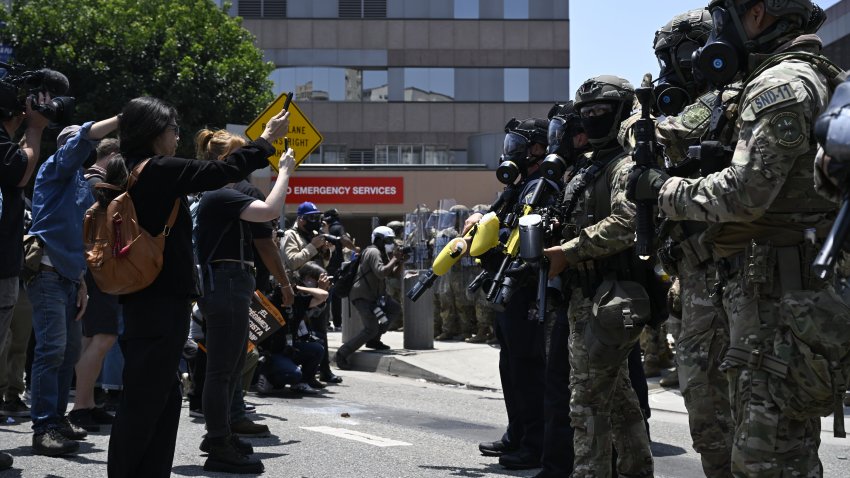 LOS ANGELES, CALIFORNIA - JUNE 8: ICE officers and national guards confront with protesters outside of the Metropolitan Detention Center in Los Angeles, California on June 8, 2025 amid protests over immigration raids. (Photo by Tayfun Coskun/Anadolu via Getty Images)
