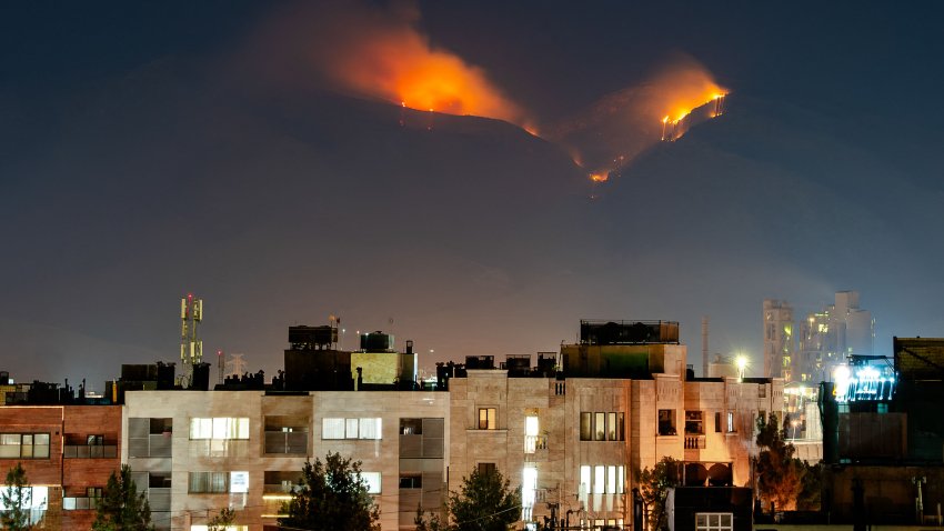 Smoke rises as fire burns, in an alleged site of IRGC’s missile launch targeted by Israel on the mountains of Shiraz, Iran on June 21, 2025. Israel attacked Iran in early hours of June 13, and the exchange of fire between the two countries continues ever since. (Photo by Hiroon / Middle East Images via AFP) (Photo by HIROON/Middle East Images/AFP via Getty Images)