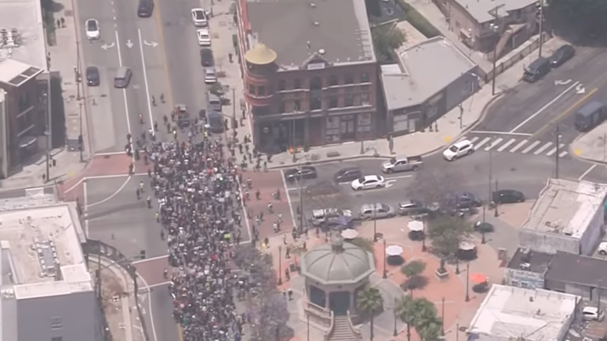Demonstrators march Sunday June 8, 2025 in Boyle Heights.
