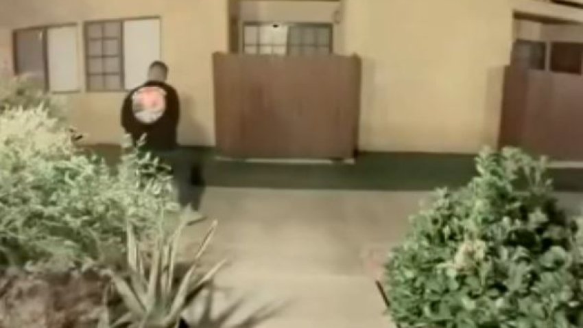 Security camera video showed the husband of a missing woman found dead in Angeles National Forest dragging what appeared to be a large object from their apartment.