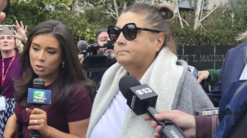 Dana Williamson, a former top aide to Gov. Gavin Newsom, center, leaves the courthouse on Nov. 12, 2025, in Sacramento, Calif.